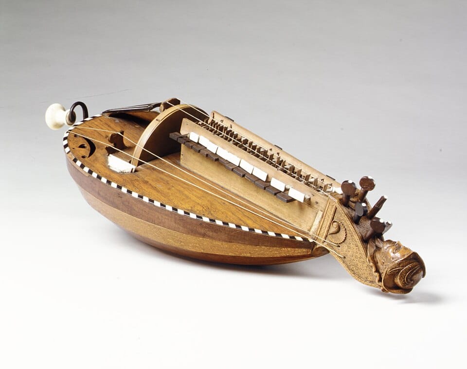 Wooden hurdy-gurdy with keyboard, strings and hand-operated crank