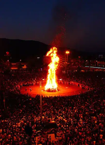Yi Torch Festival participants carrying torches during a nighttime celebration in southwest China