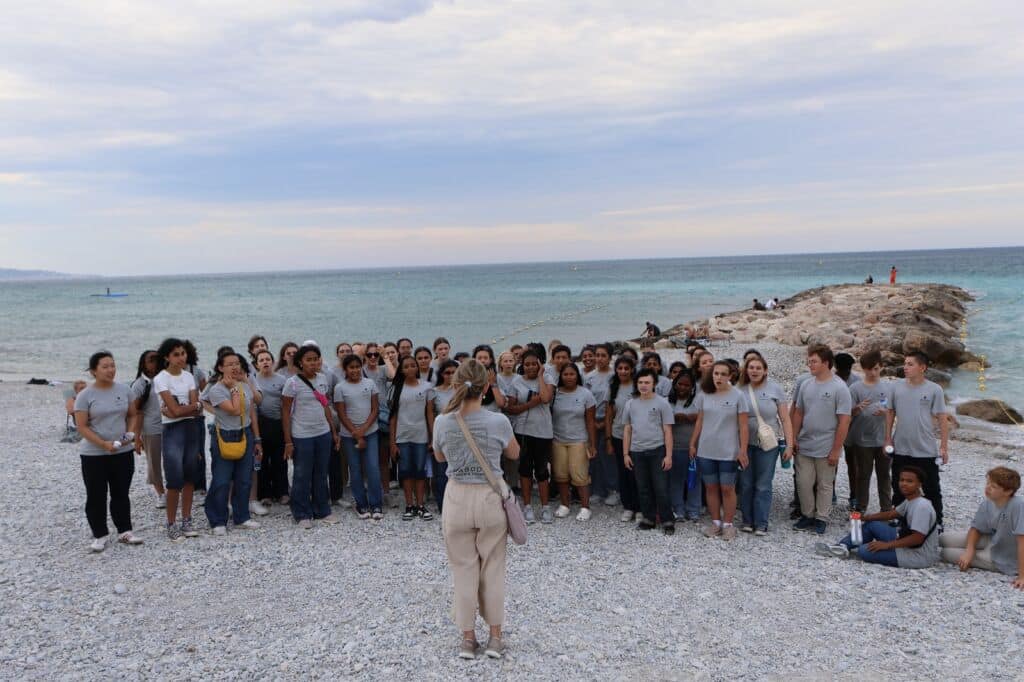 Peabody Children's Chorus singing on the beach in southern France