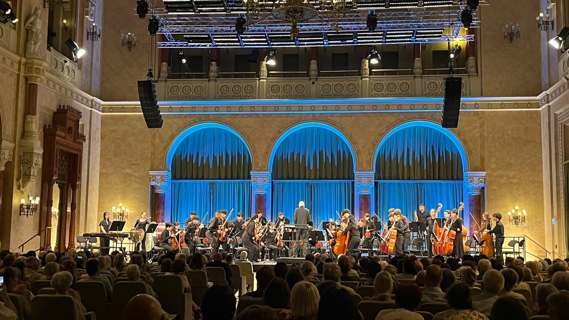 Sacramento Youth Symphony performing at Vigadó Hall in Budapest before a full audience