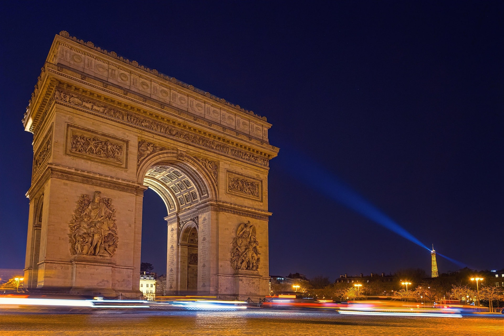 The Arc de Triomphe in Paris lit up at night
